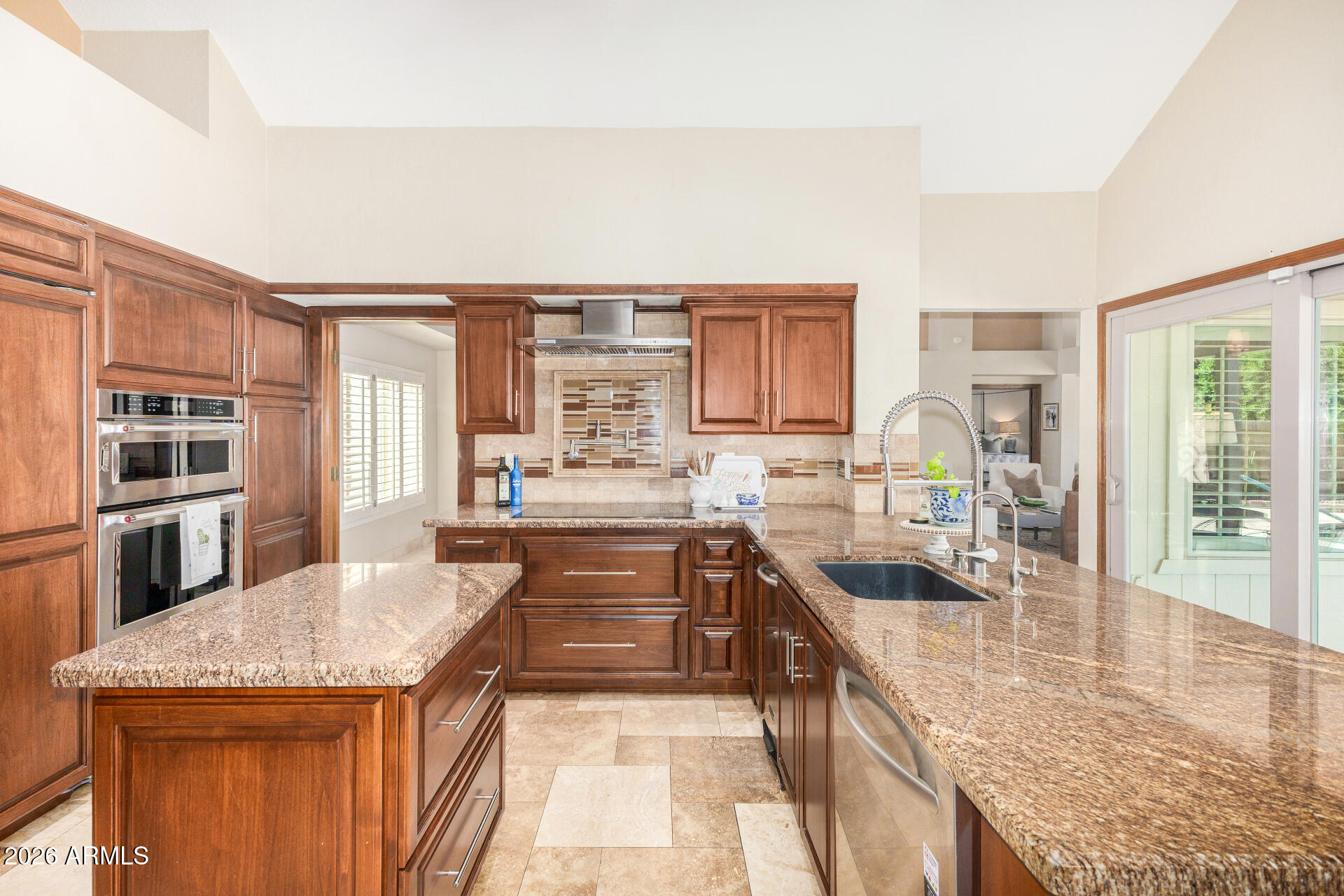 1942 East Krista Way Tempe, AZ 85284 - Photo 9 of 51 a kitchen with a stove a sink and a wooden cabinets