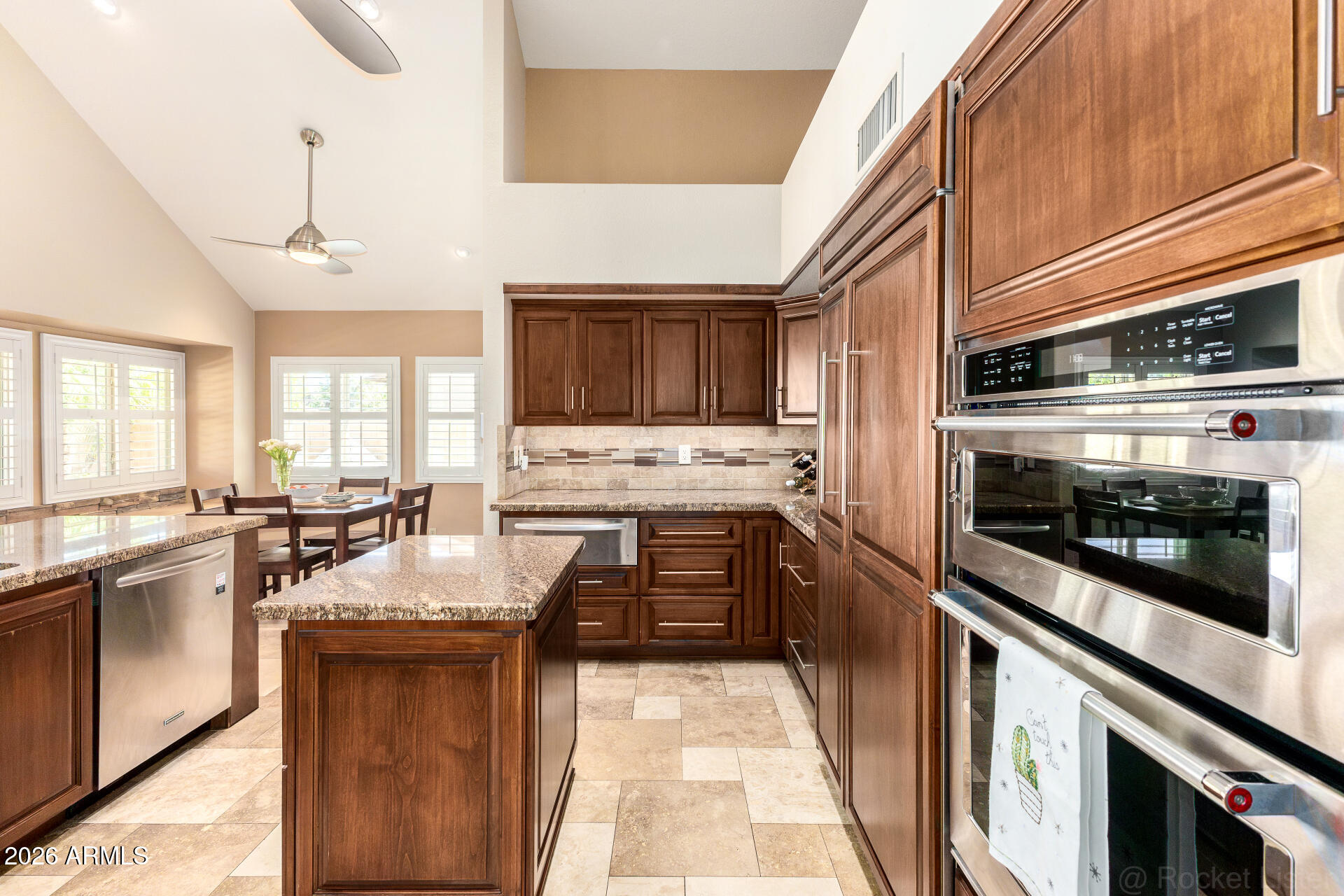 1942 East Krista Way Tempe, AZ 85284 - Photo 10 of 51 a kitchen with granite countertop stainless steel appliances and wooden cabinets