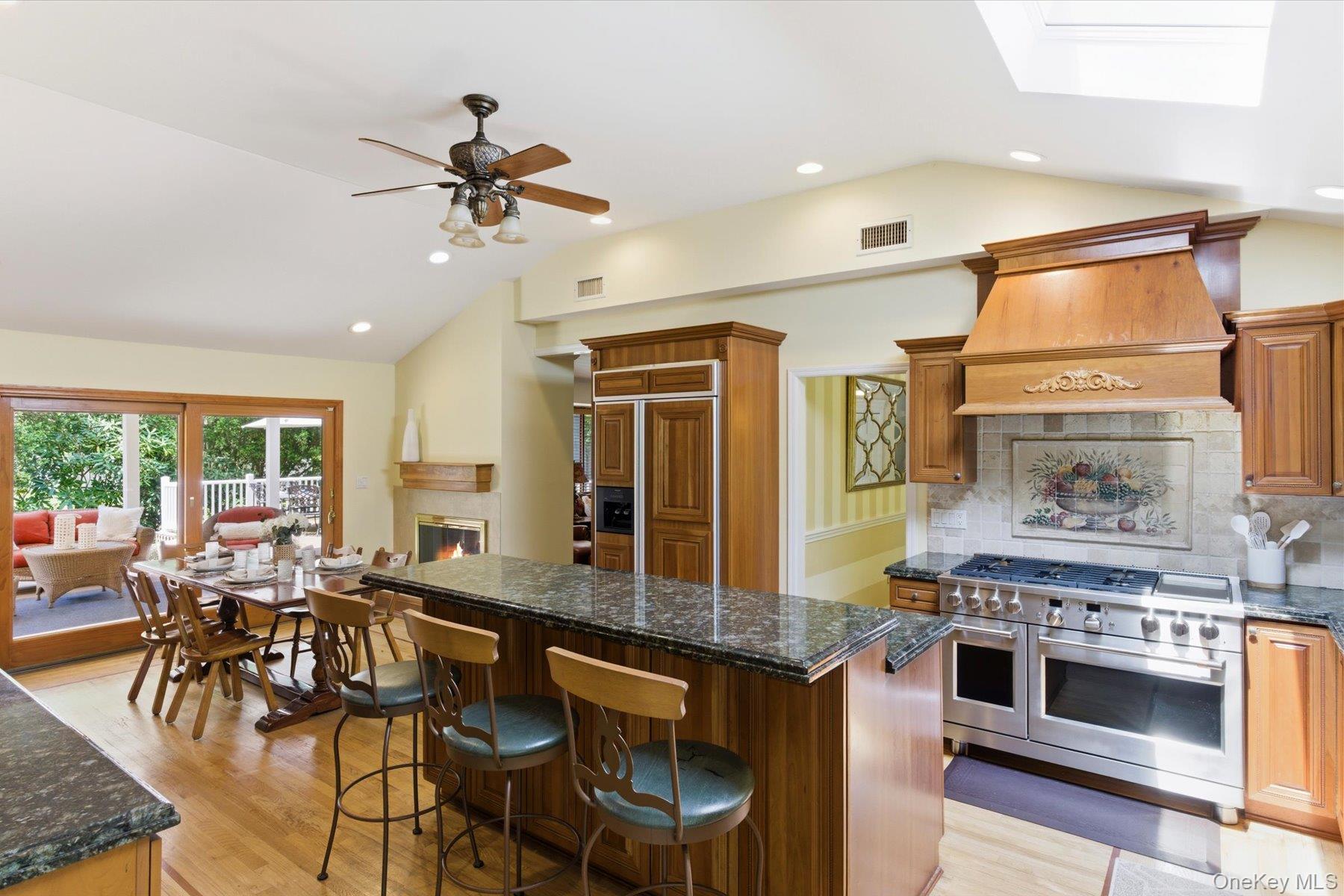 6 Brandy Road Cold Spring Harbor, NY 11724 - Photo 6 of 25 a kitchen with stainless steel appliances a stove a sink and a refrigerator