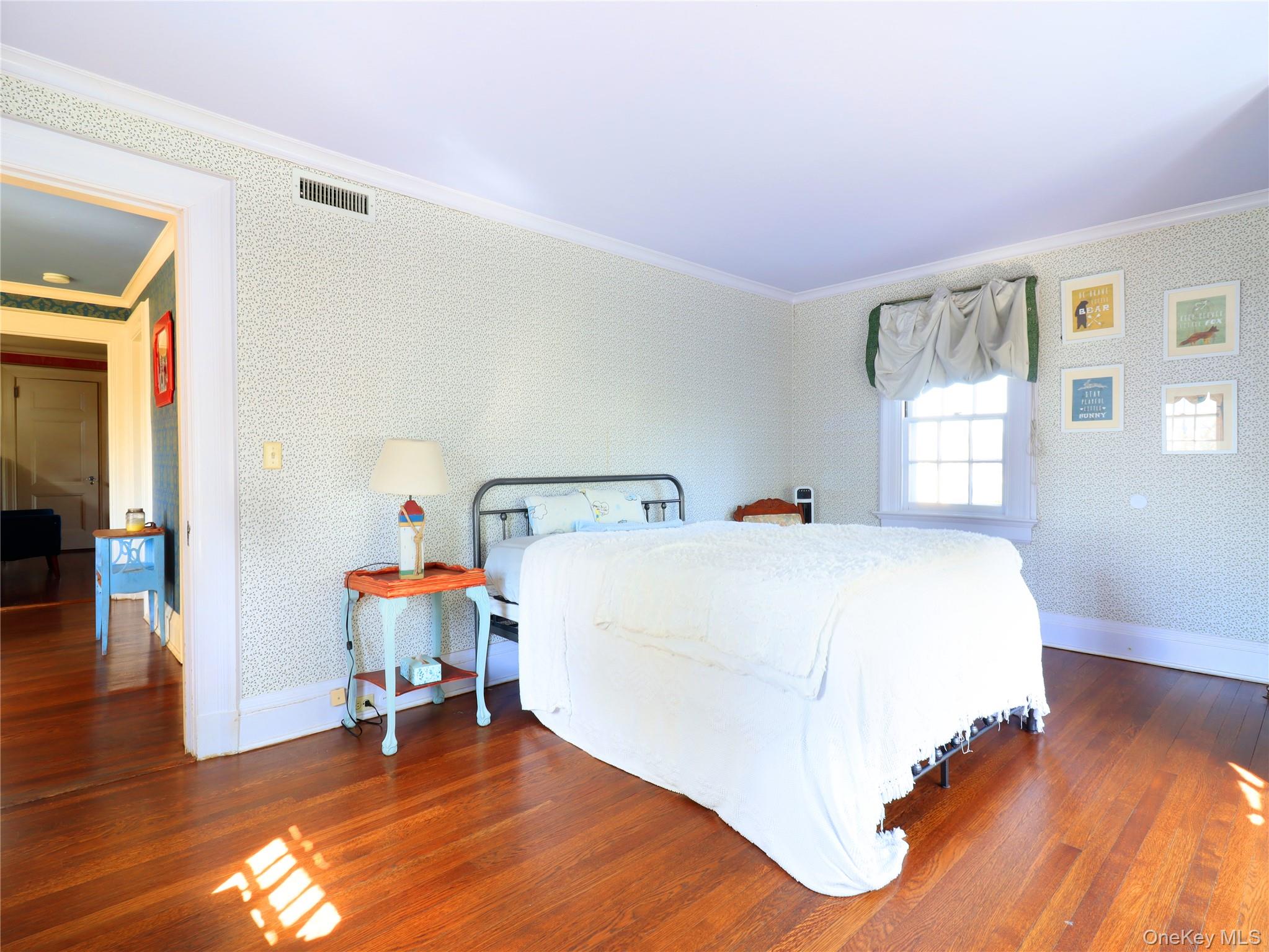 11-20 Shore Road Queens, NY 11363 - Photo 35 of 45 Hardwood flooring complements a patterned wall covering