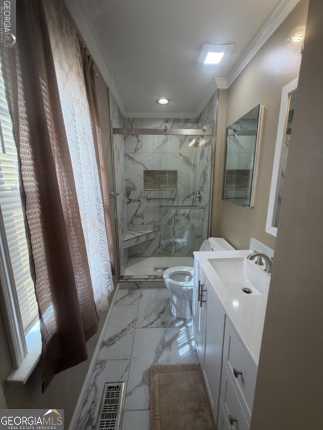 4276 Cedar Valley Court Conley, GA 30288 - Photo 11 of 13 a bathroom with a sink a toilet and shower
