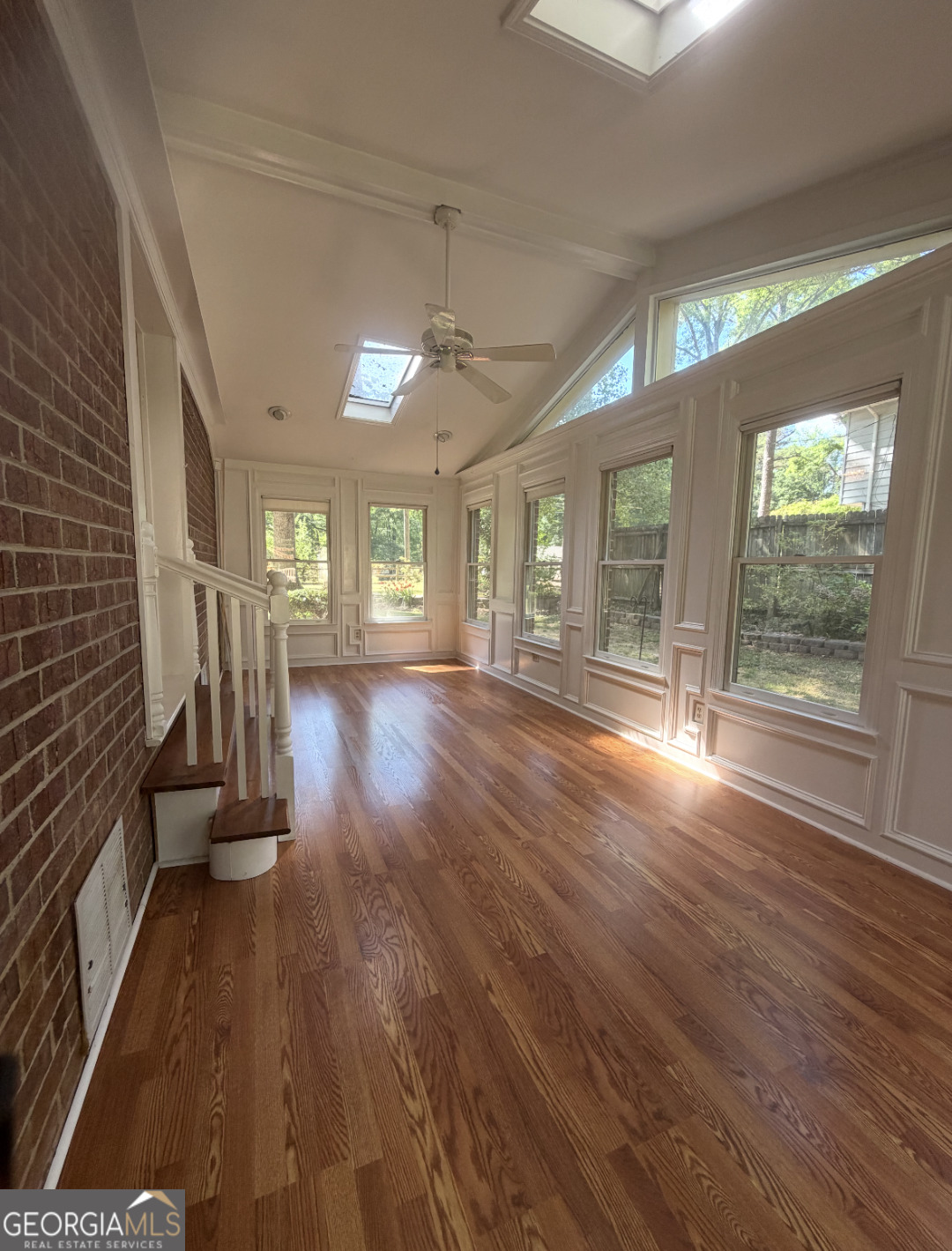 4276 Cedar Valley Court Conley, GA 30288 - Photo 4 of 13 wooden floor in an empty room with a window