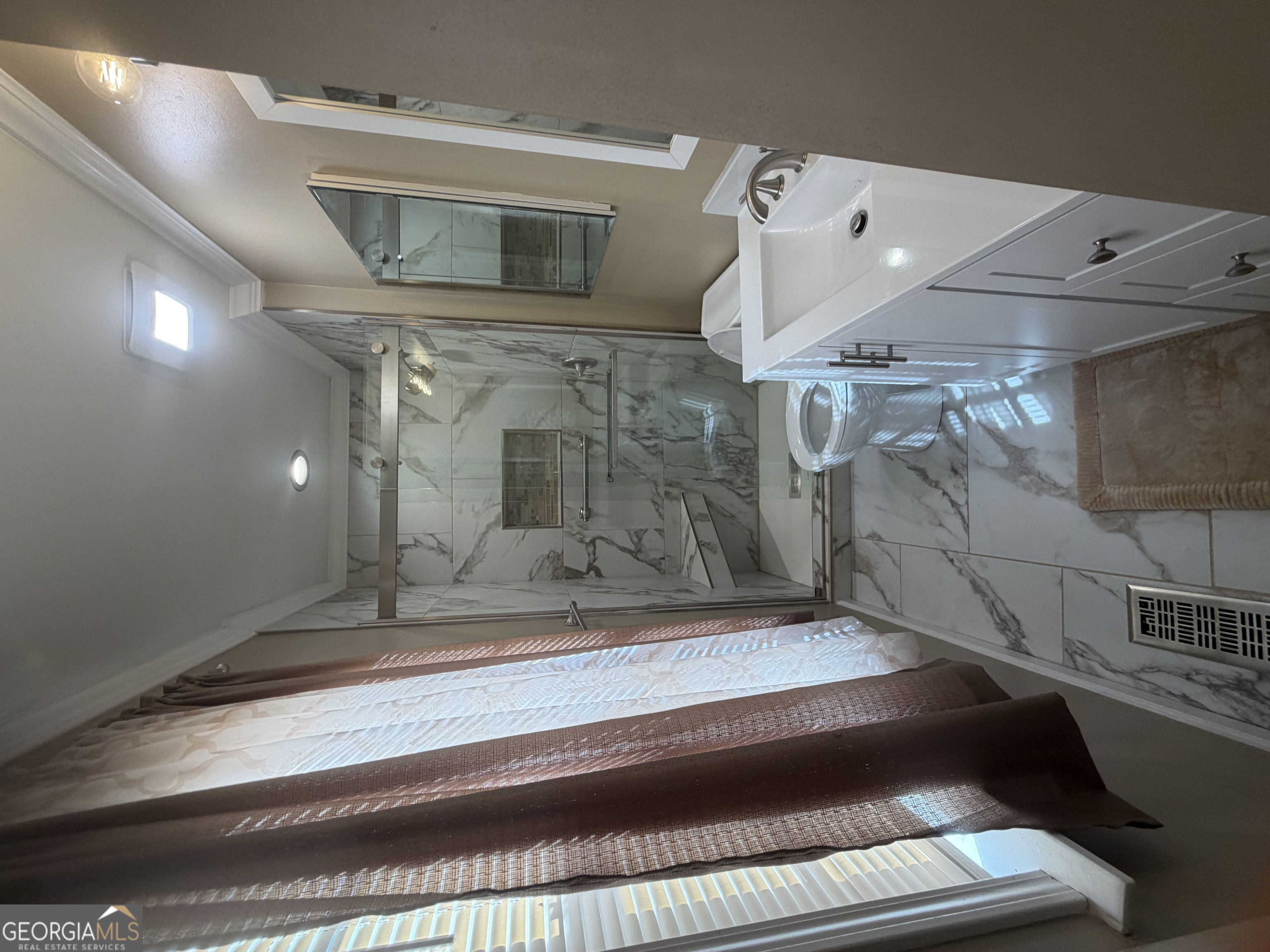 4276 Cedar Valley Court Conley, GA 30288 - Photo 6 of 13 a bathroom with a sink and mirror