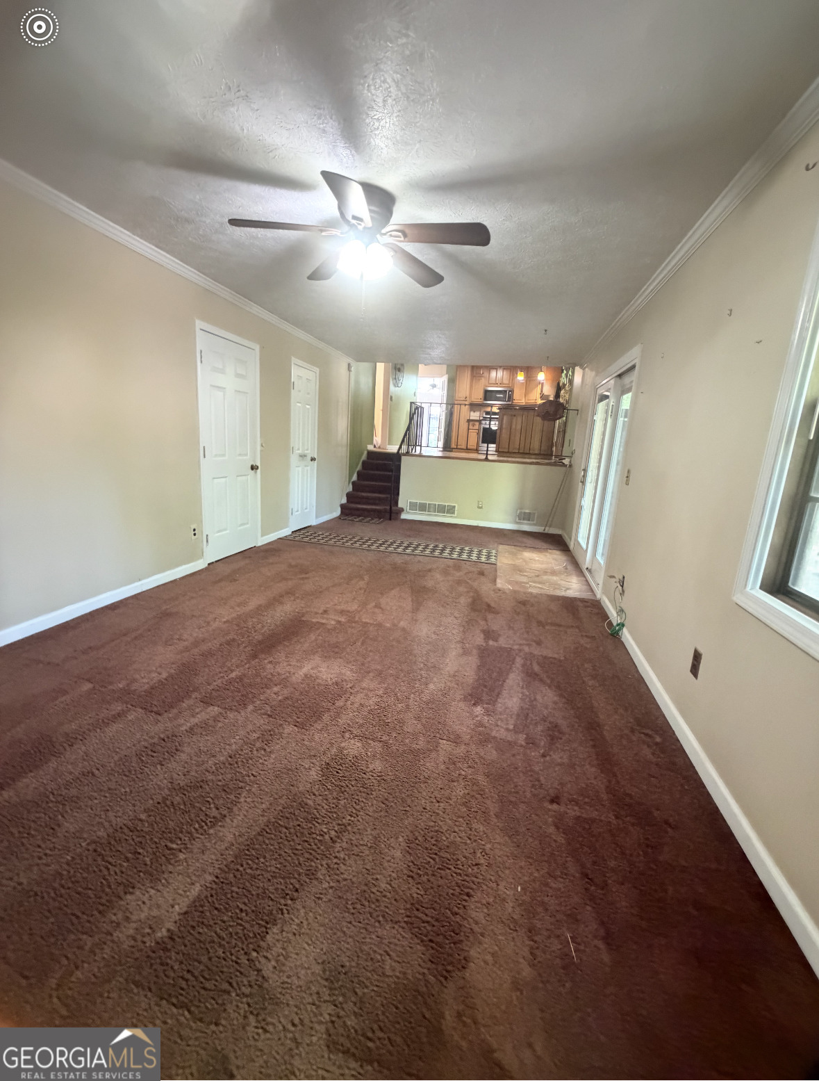 4276 Cedar Valley Court Conley, GA 30288 - Photo 10 of 13 a view of a livingroom with a ceiling fan and window