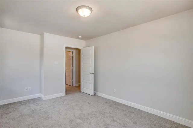 an empty room with closet area