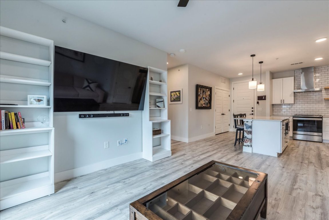 3101 Govalle Avenue, Unit 220 Austin, TX 78702 - Photo 8 of 26 a living room with furniture and a flat screen tv