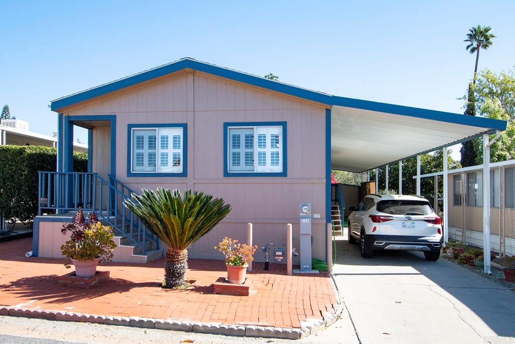 1120 East Mission Road, Unit 40 Fallbrook, CA 92028 - Photo 1 of 1 a view of a car park in front of house