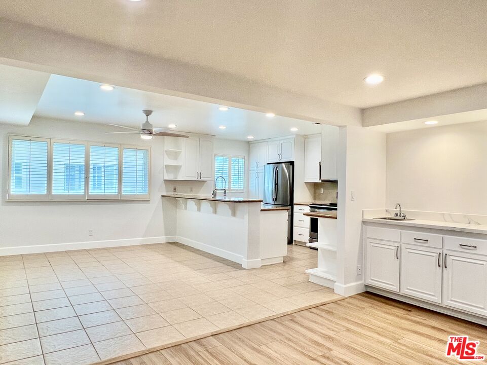 13218 Fiji Way, Unit B Marina del Rey, CA 90292 - Photo 16 of 63 a view of kitchen with wooden floor and electronic appliances