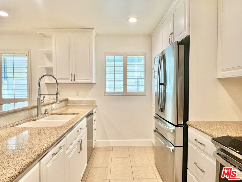 13218 Fiji Way, Unit B Marina del Rey, CA 90292 - Photo 19 of 63 a view of a kitchen with a sink and a refrigerator