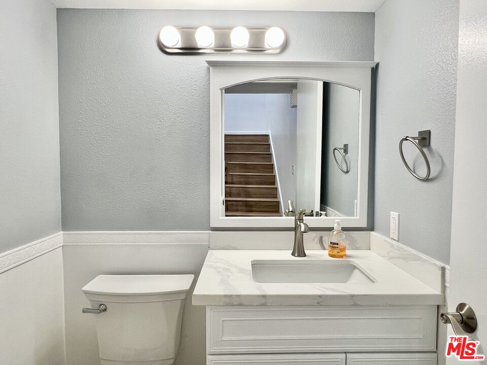 13218 Fiji Way, Unit B Marina del Rey, CA 90292 - Photo 28 of 63 a bathroom with a sink and a mirror