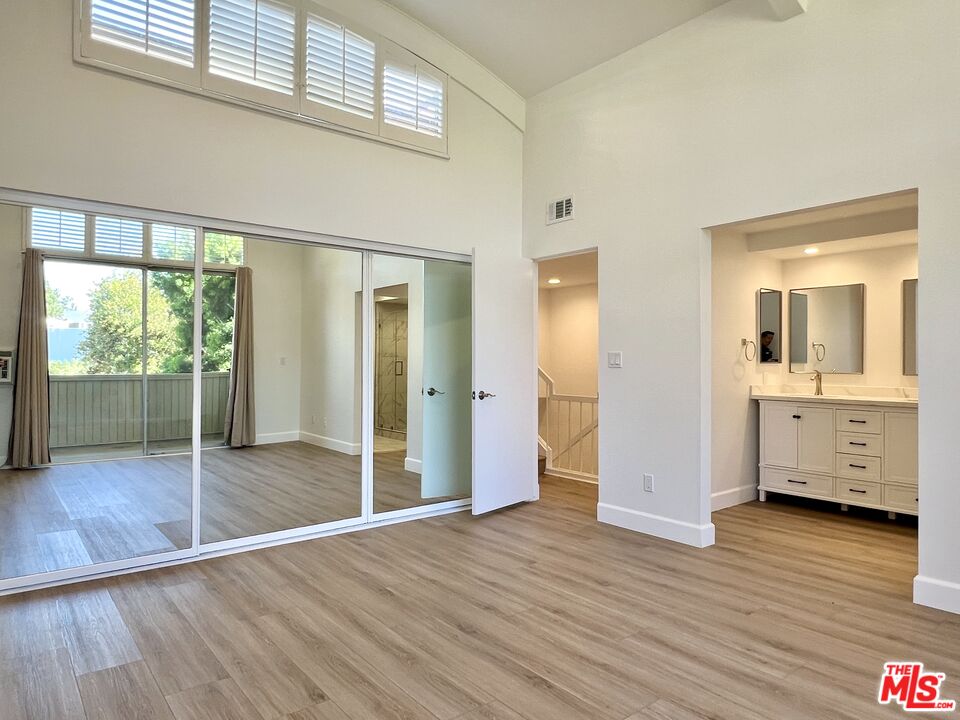 13218 Fiji Way, Unit B Marina del Rey, CA 90292 - Photo 33 of 63 a view of livingroom with furniture wooden floor and window