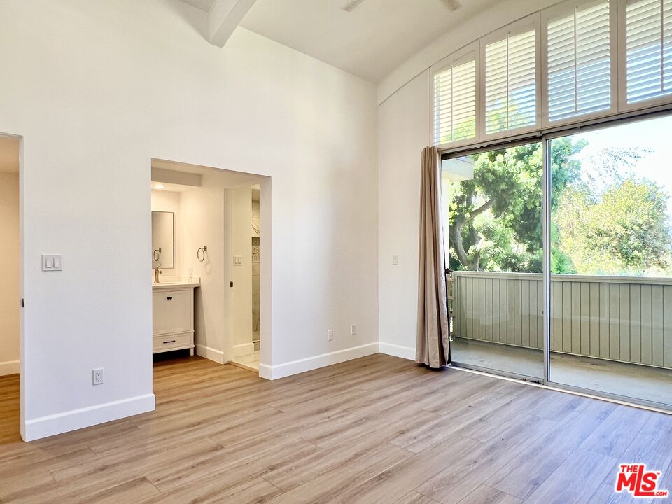 13218 Fiji Way, Unit B Marina del Rey, CA 90292 - Photo 34 of 63 a view of empty room with wooden floor and fan