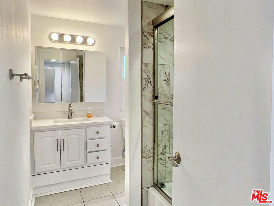 13218 Fiji Way, Unit B Marina del Rey, CA 90292 - Photo 40 of 63 a spacious bathroom with a shower sink and mirror