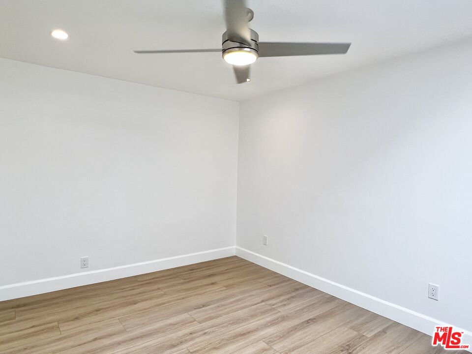 13218 Fiji Way, Unit B Marina del Rey, CA 90292 - Photo 49 of 63 a view of an empty room with wooden floor