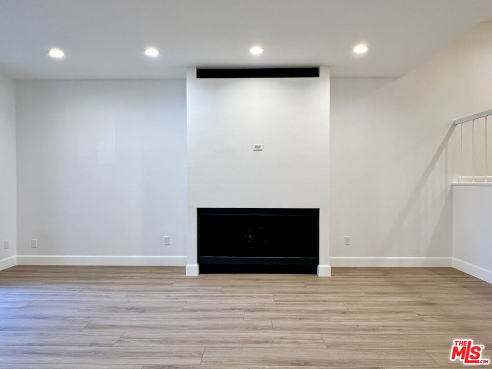 13218 Fiji Way, Unit B Marina del Rey, CA 90292 - Photo 10 of 63 a view of an empty room with wooden floor