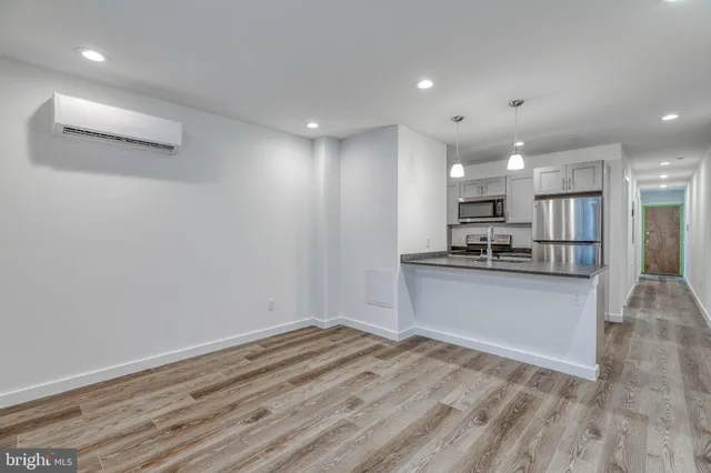 a view of kitchen with wooden floor