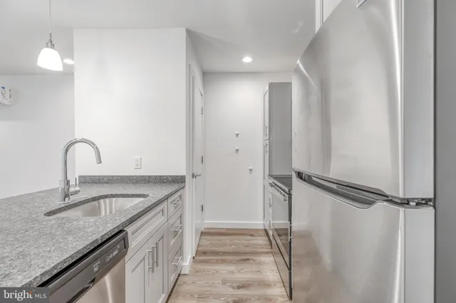 a bathroom with a granite countertop sink and a granite top