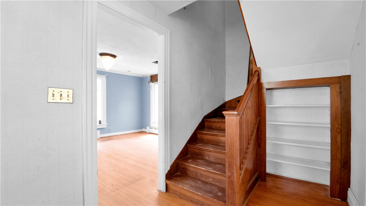 150 William Kidder Road Lancaster, NY 14086 - Photo 6 of 39 The central hallway showcasing the original wood s