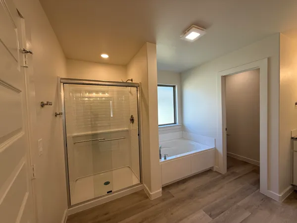 a bathroom with a glass shower door