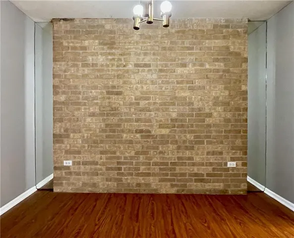 a bathroom with a wooden floor