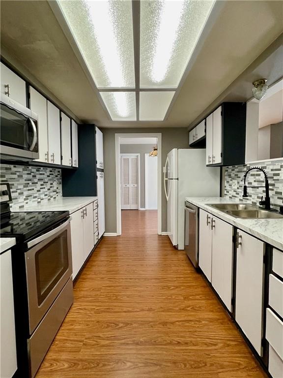 5444 Stonegate Way Corpus Christi, TX 78411 - Photo 6 of 13 a large kitchen with stainless steel appliances granite countertop a stove a sink dishwasher and a refrigerator