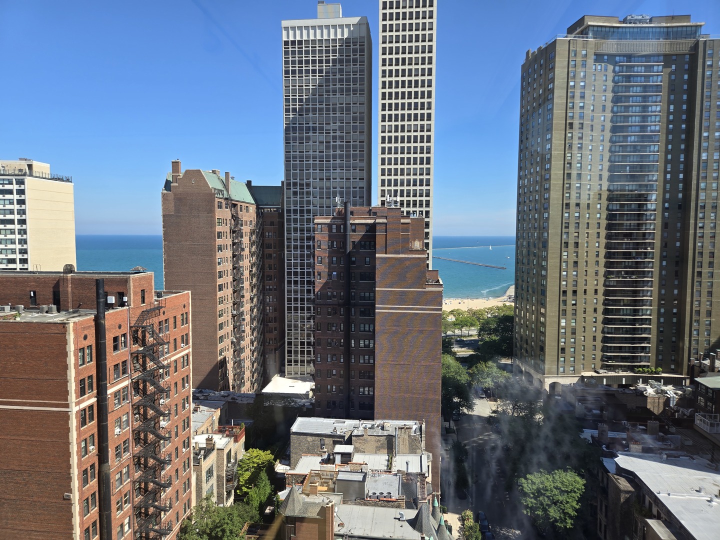 40 East Cedar Street, Unit 21C Chicago, IL 60611 - Photo 16 of 33 a city view with tall buildings