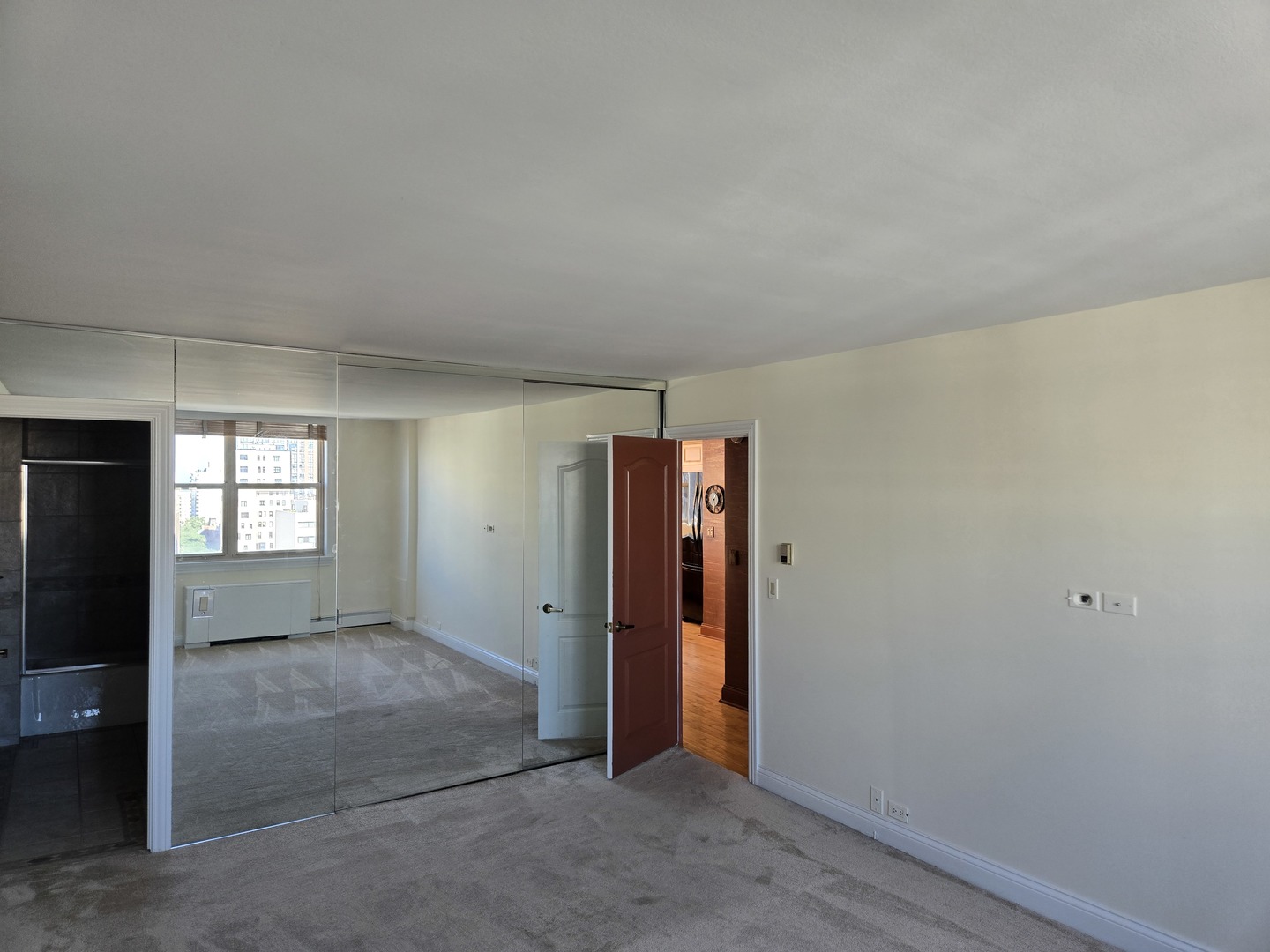 40 East Cedar Street, Unit 21C Chicago, IL 60611 - Photo 26 of 33 an empty room with windows and closet