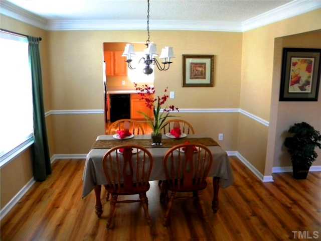 4613 Marathon Lane Raleigh, NC 27616 - Photo 5 of 24 Dining room features 2 piece crown molding and chair rail.