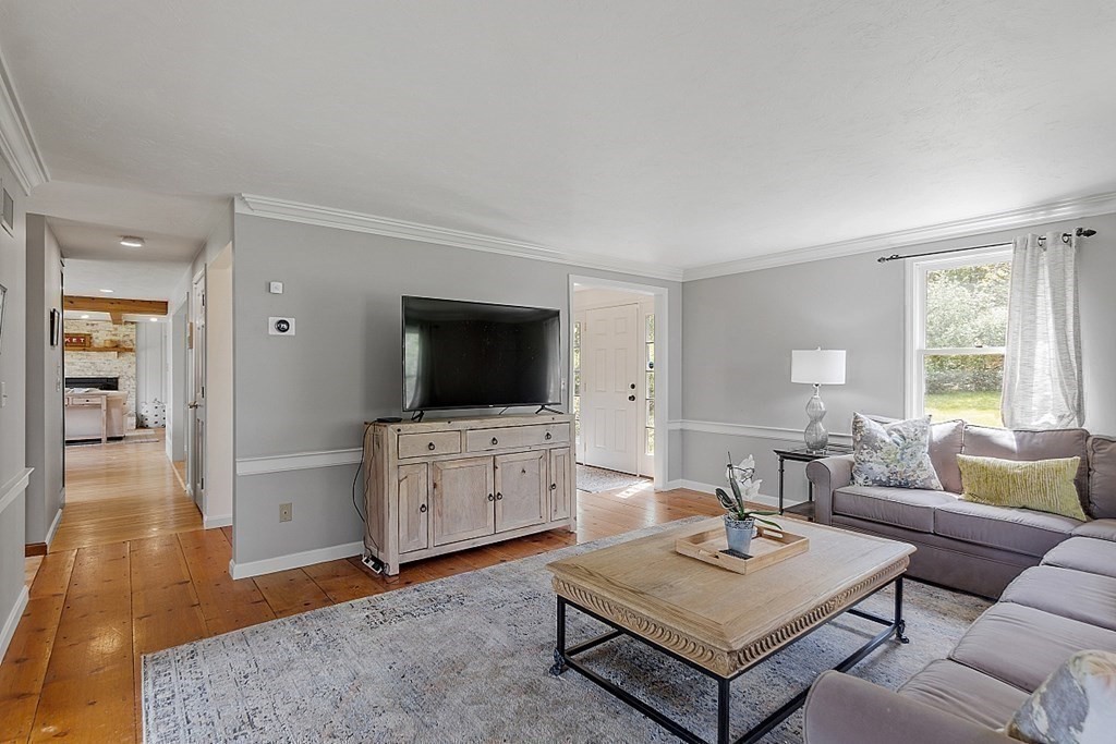 198 Still River Road Bolton, MA 01740 - Photo 21 of 36 a living room with furniture and a flat screen tv