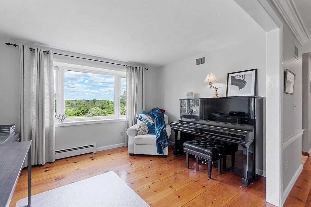 198 Still River Road Bolton, MA 01740 - Photo 23 of 36 a living room with furniture and a piano