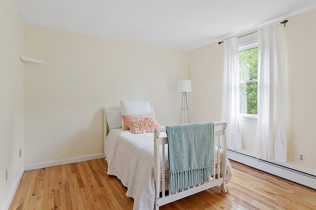 198 Still River Road Bolton, MA 01740 - Photo 29 of 36 a bedroom with a bed and wooden floor