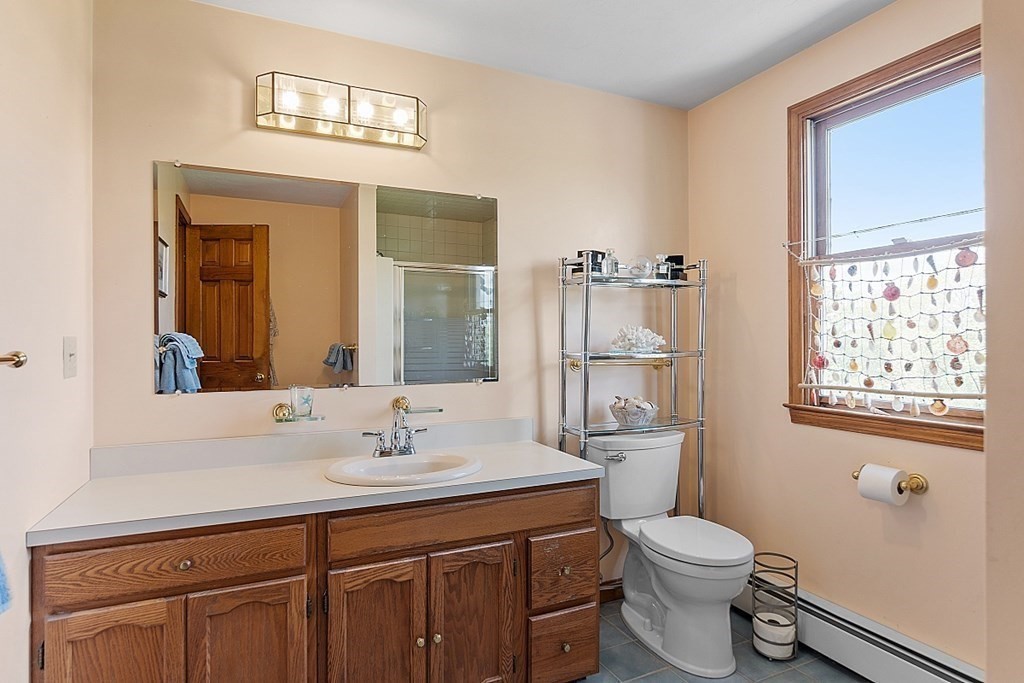 198 Still River Road Bolton, MA 01740 - Photo 32 of 36 a bathroom with a sink a toilet and shower