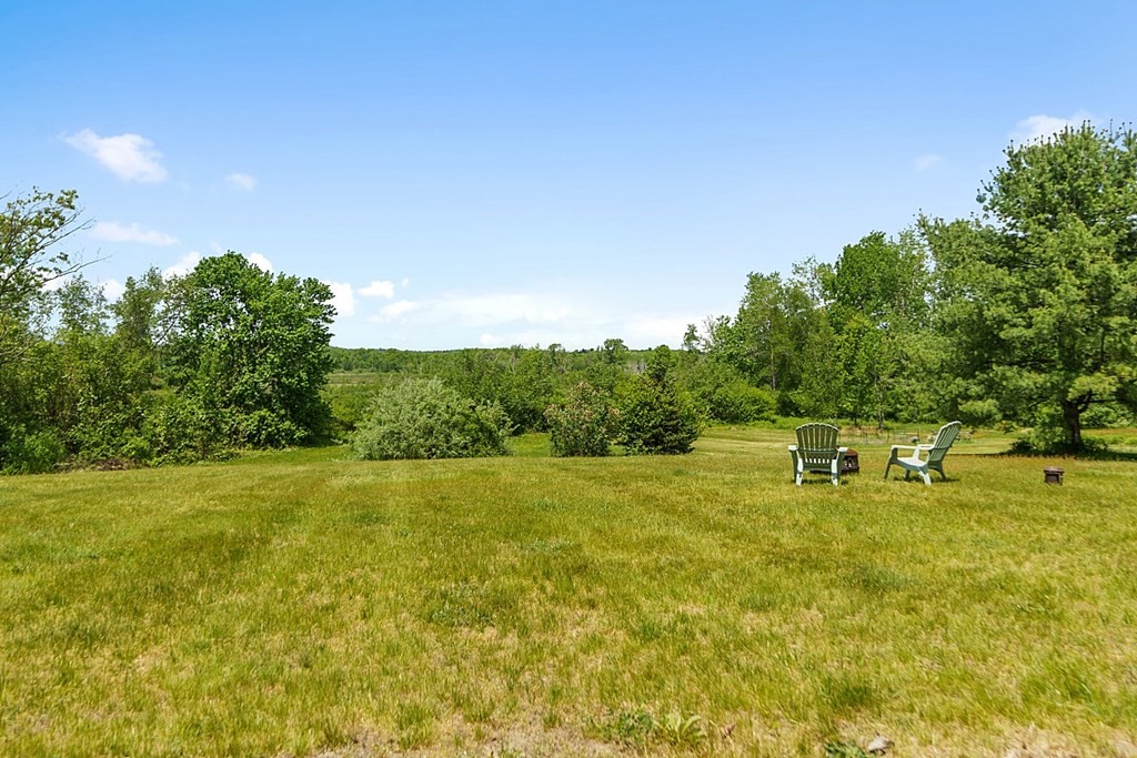 198 Still River Road Bolton, MA 01740 - Photo 36 of 36 a backyard of a house with table and chairs