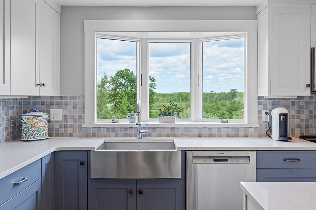 198 Still River Road Bolton, MA 01740 - Photo 5 of 36 a kitchen with stainless steel appliances a sink a stove and a window