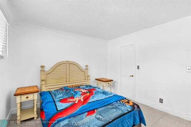 a bedroom with bed and a dresser