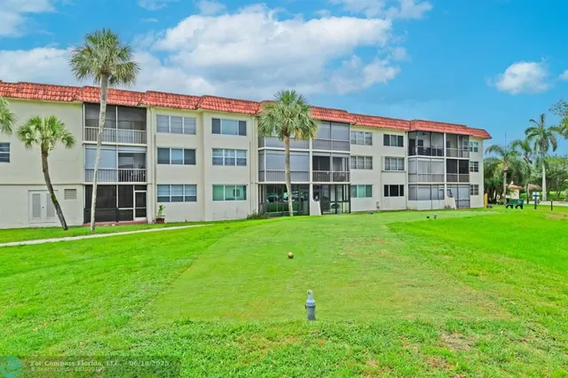 a view of an apartment with a garden