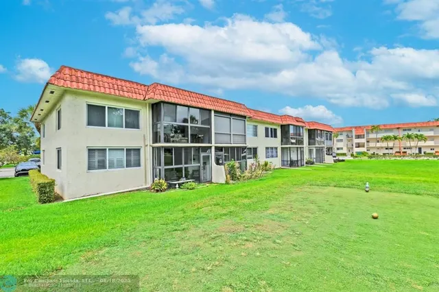 a view of an apartment with a garden