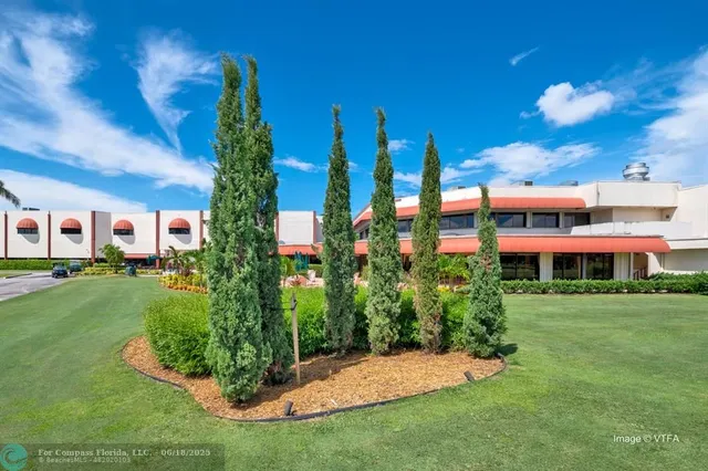 a view of a building with a yard