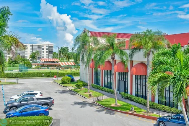 a view of a park with iron fence
