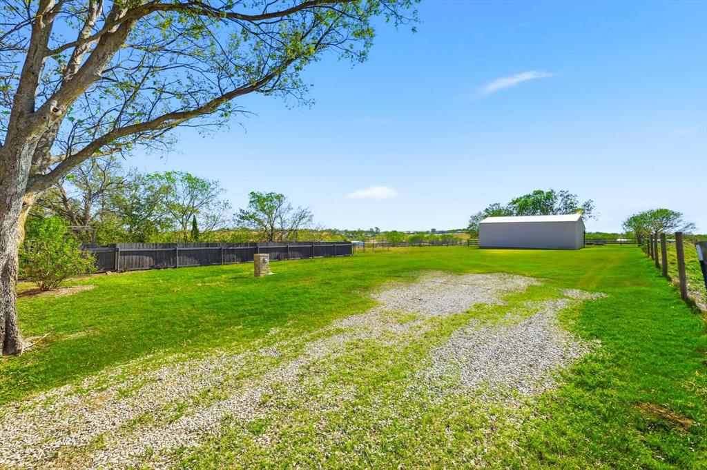 3873 Lois Road East Sanger, TX 76266 - Photo 35 of 40 View of yard featuring a pole building and an outdoor structure