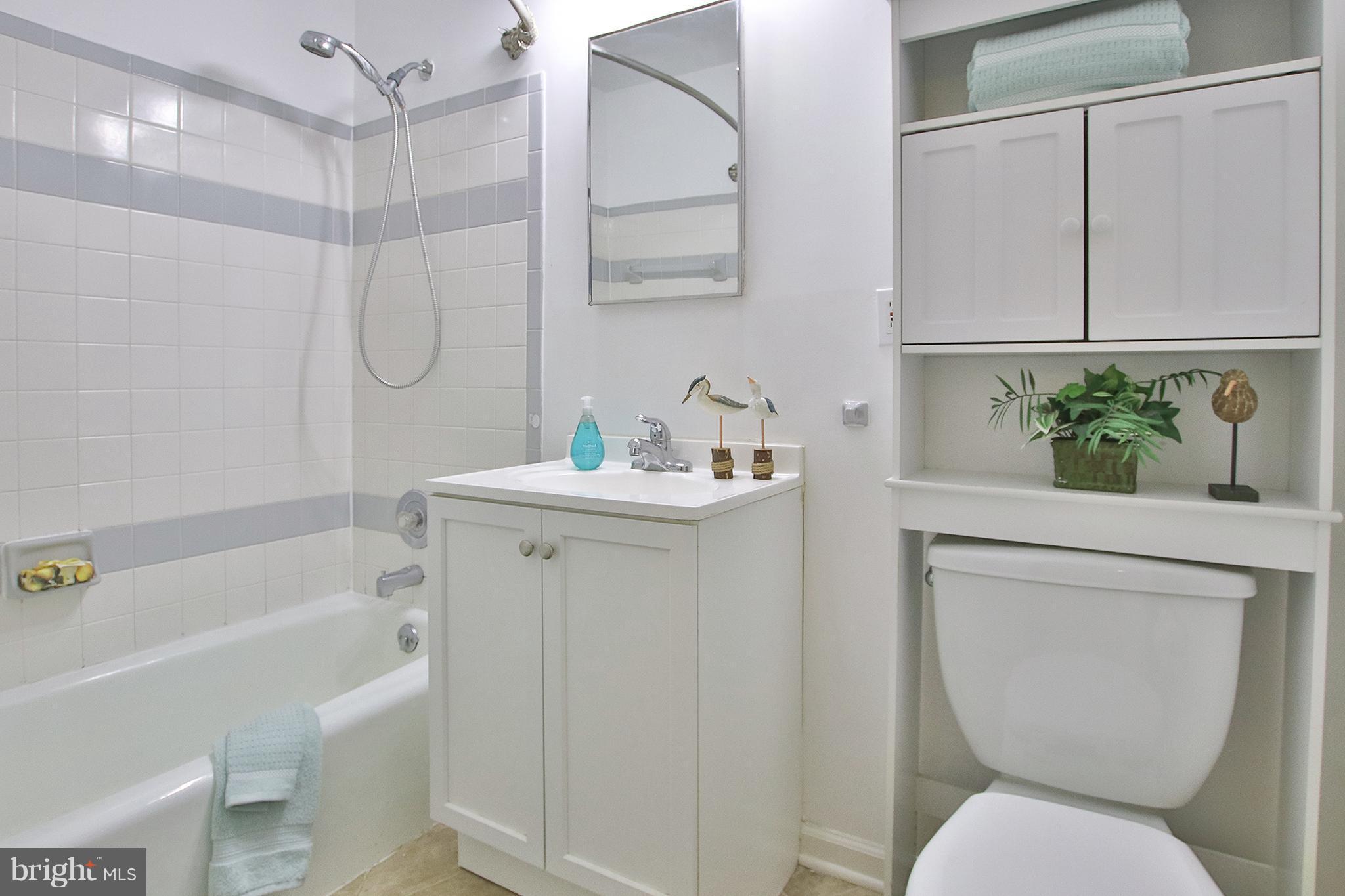 2203 Coppersmith Square Reston, VA 20191 - Photo 15 of 25 a bathroom with a sink toilet and shower