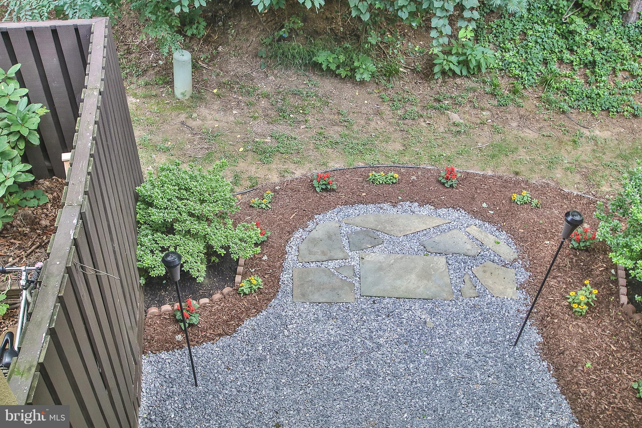 2203 Coppersmith Square Reston, VA 20191 - Photo 18 of 25 a view of a backyard