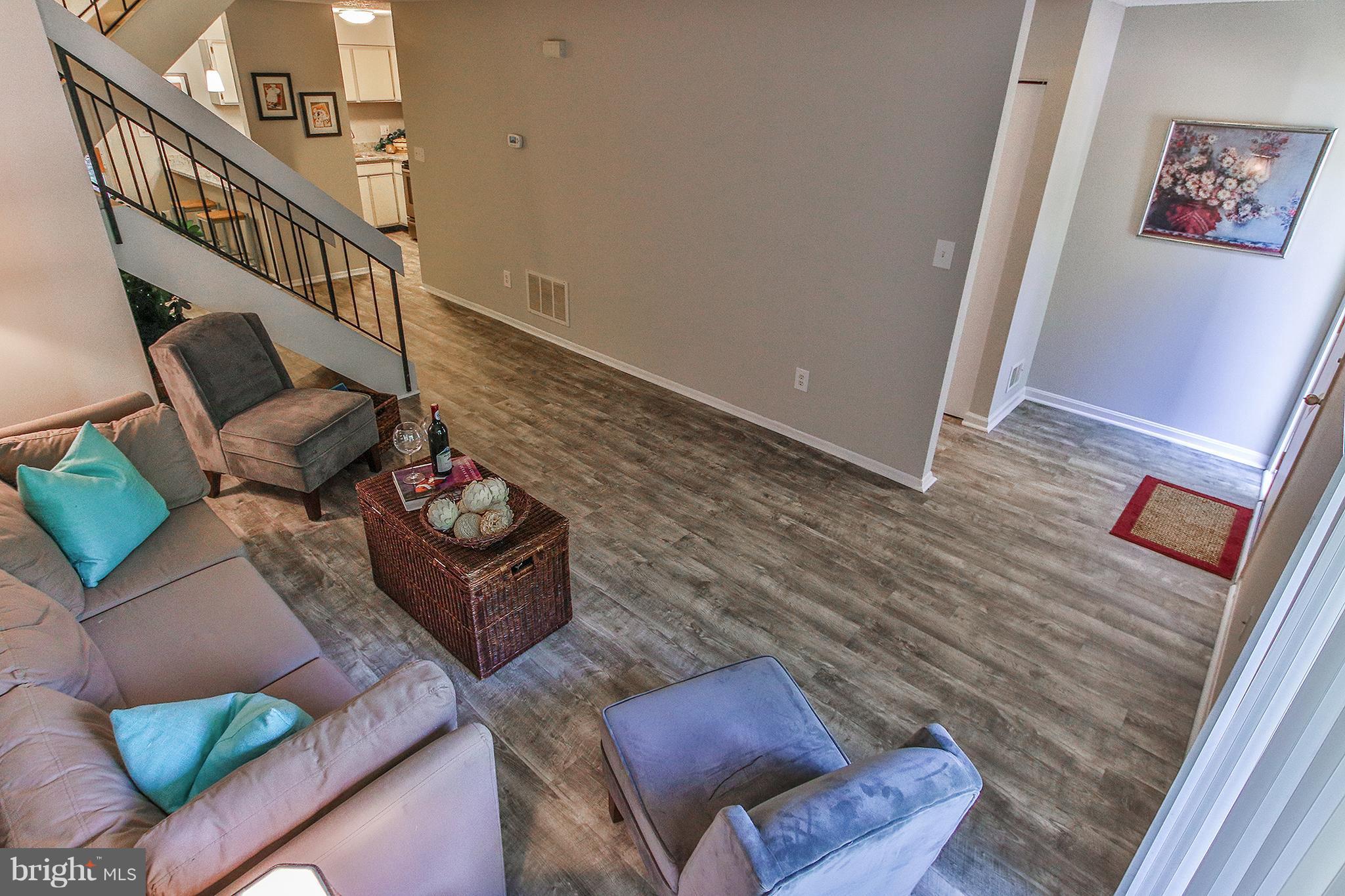 2203 Coppersmith Square Reston, VA 20191 - Photo 25 of 25 a living room with furniture and stairs