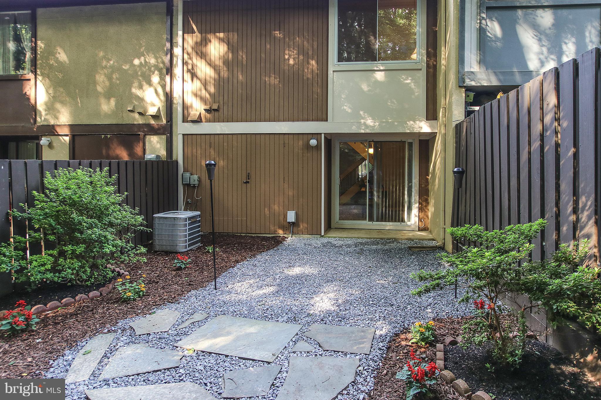 2203 Coppersmith Square Reston, VA 20191 - Photo 20 of 25 a view of a door of a house with a yard