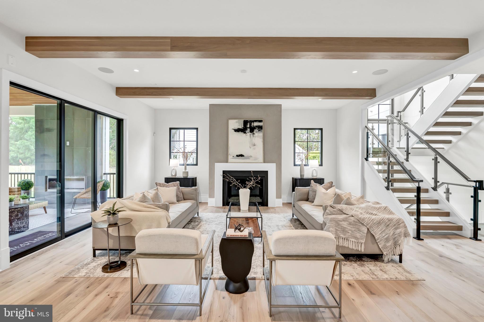 5425 Moorland Lane Bethesda, MD 20814 - Photo 14 of 79 a living room with furniture large window and a fireplace