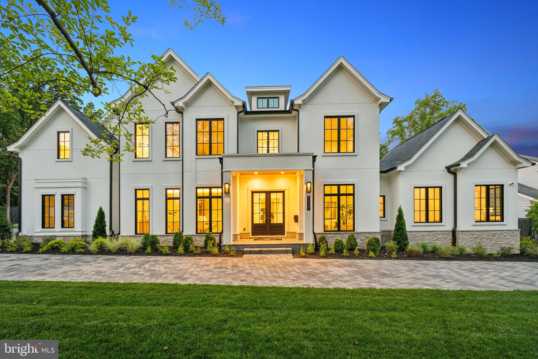 5425 Moorland Lane Bethesda, MD 20814 - Photo 2 of 79 front view of brick house with a yard