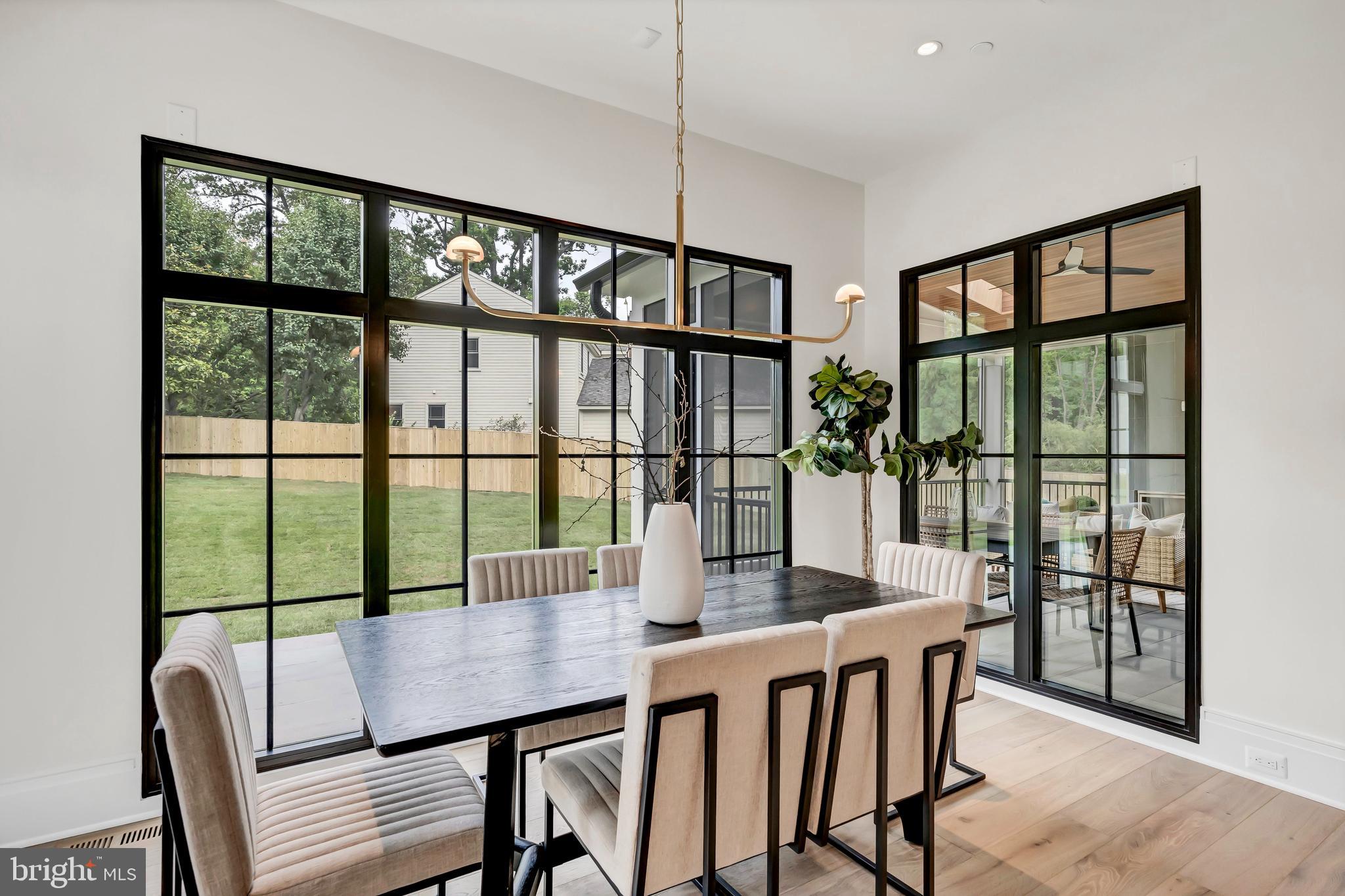 5425 Moorland Lane Bethesda, MD 20814 - Photo 22 of 79 a view of a dining room with furniture window and wooden floor