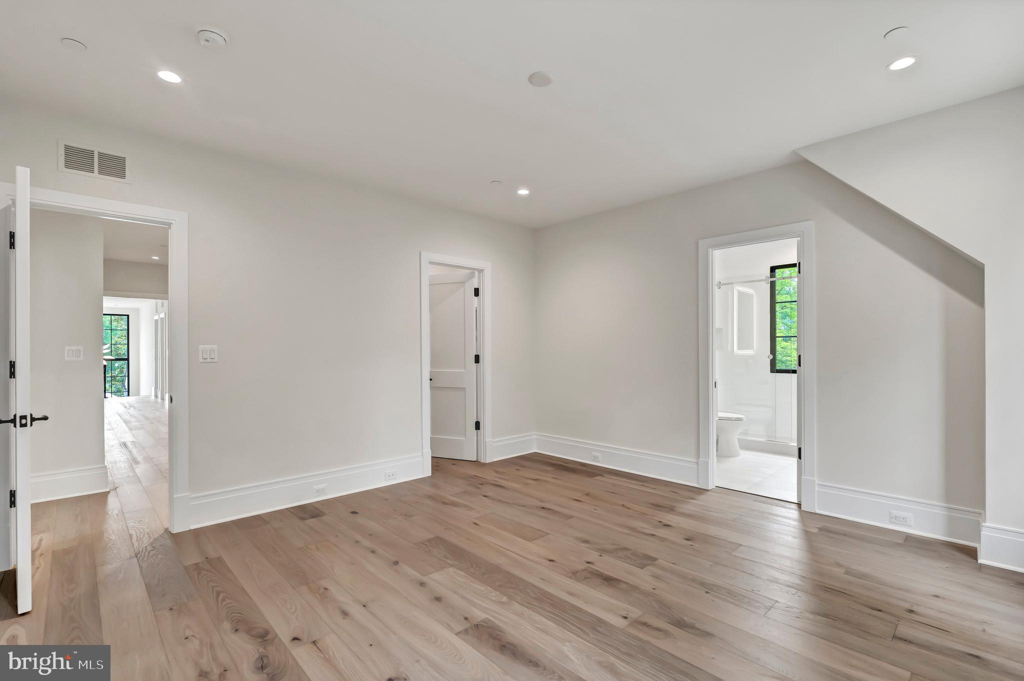 5425 Moorland Lane Bethesda, MD 20814 - Photo 53 of 79 an empty room with wooden floor and windows