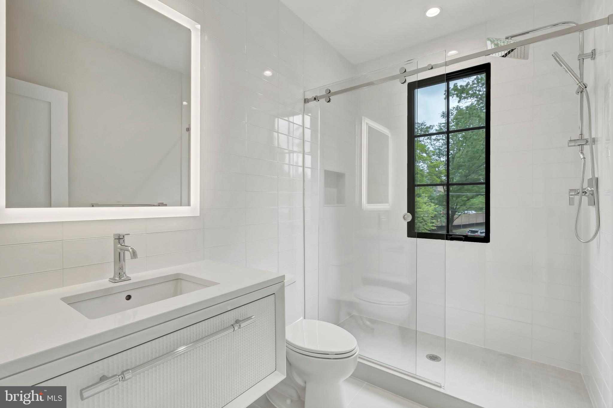 5425 Moorland Lane Bethesda, MD 20814 - Photo 54 of 79 a bathroom with a sink toilet and shower