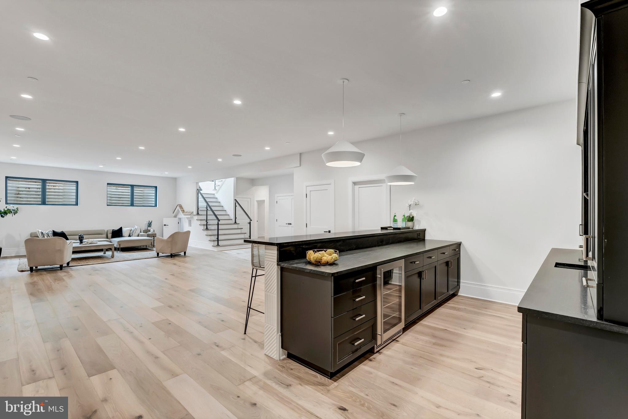 5425 Moorland Lane Bethesda, MD 20814 - Photo 59 of 79 a kitchen with stainless steel appliances granite countertop a stove and a wooden floors